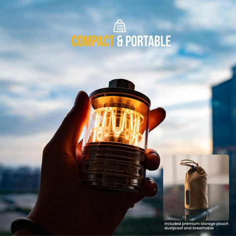Hand holding Vintage Aluminum Camping Lantern With Dimmable 2100K Warm Glow, USB-C power, against sky backdrop