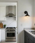 Black Industrial Wall Sconce With 8.1 Inch Metal Shade Vintage Retro Vibe 1 Light Wall Lamp in a modern kitchen setting