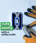 Cutting Double Bubble Reflective Foil Insulation Roll 48 X 75 Feet with a utility knife for easy installation.