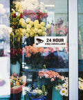 24 Hour Video Surveillance Sign 9x3 Inch Aluminum Silver Self Adhesive Metal Door Wall Sign Waterproof on flower shop window.