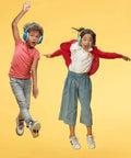 Kids jumping while wearing kid friendly noise canceling headphones for concentration and hearing protection, bright blue.