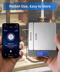 Digital Gram Scale 0.01g Precision Pocket Sized Kitchen Jewelry Scale 0.3g To 500g For Gold Coins Coffee Powder With 9 Units 2 Trays And 2 AAA Batteries Black Design next to smartphone for size comparison.