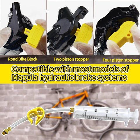 Hydraulic Disc Brake Bleed Kit for Magura Systems showing adapters and syringe for oil monitoring, compatible with most models