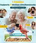 Elderly couple viewing birds on phone, using 2K HD Bird Feeder Camera With Solar Power And 32GB Card Auto Detect And Notify AI ID 155