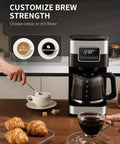 10 Cup Programmable Coffee Maker With Regular And Strong Brew Auto Shut Off Permanent Filter Easy LCD Touch Screen Great For Home Or Office Silver Finish, shown with coffee and pastries.