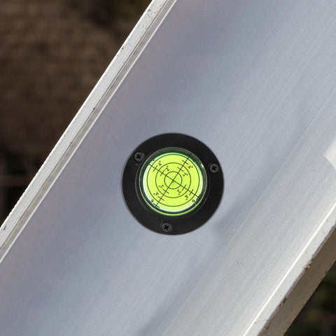 Bubble level close-up on an aluminum tool, part of 4pcs Acrylic Cylindrical Mini Spirit Level Tool for Precise Measuring.