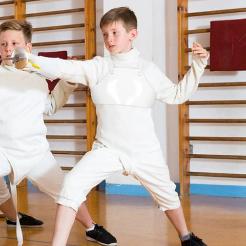 Young fencer wearing Youth Fencing Chest Guard Lightweight PVC Chest Protector For Boys Kid Friendly Comfort And Safe Practice Gear