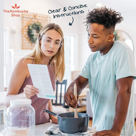 Couple reading instructions for 100 Percent Organic SCOBY Kombucha Starter Kit For Home Brew Sessions With Live Culture And Starter Liquid Ready