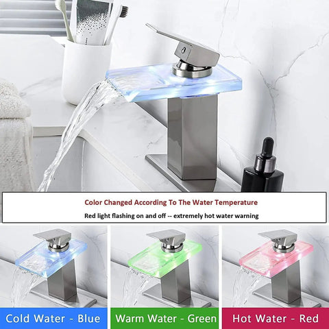 Lit LED Powered Water Glow Bathroom Faucet With Chrome Waterfall Vanity, Single Handle 1 Hole Sink Open Glass Spout Includes Pop Up Drain And 2 Supply Lines Brushed Nickel Finish, showing color-changing LED for water temperature.