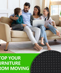 Family sitting on a couch with 8 Pack Two Point Five Inch Anti Slip Furniture Caster Cups For Hardwood Floors And All Surfaces Rubber Pads And Non Slip Grippers To Stop Furniture From Sliding Bed Couch Stoppers Floor Protection For Home Black visible under the furniture, with a close-up of a black gripper pad inset.