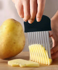 Zorveiio black stainless steel crinkle cutter slicing potato on cutting board