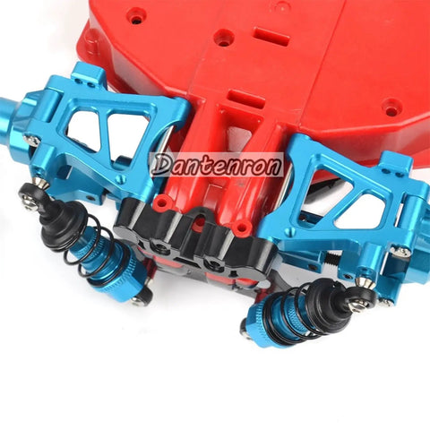 Close-up of blue Beefed Up Aluminum TT02 Swing Arm Upgrade Kit for one tenth scale on-road RC cars showing front suspension.