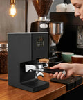 Electronic Automatic Espresso Tamper With 58mm Coffee Distribution Disc Adjustable Pressure Settings on kitchen counter