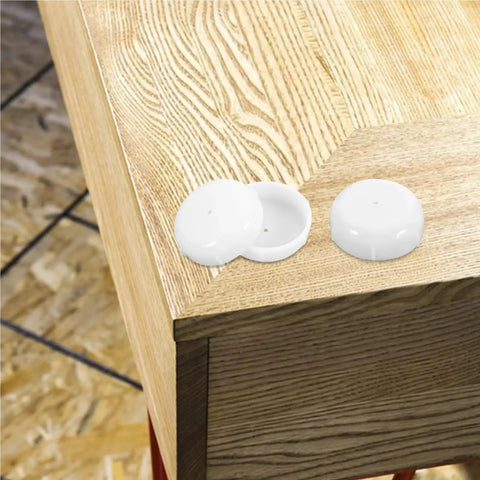 Straight Up Floor Savers Legit Deck Ready 160 Piece Patio Furniture Glides on a wooden table surface, showing white plastic caps.