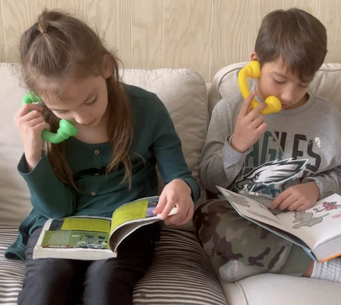 Children using Whisper Reading Phones and Highlight Strips Bundle, 12 Pack for Classroom Fluency Practice, Quiet Reading Time Tools.