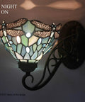 Tiffany Style Wall Sconce Plug In Swing Arm Light With Sea Blue Stained Glass Dragonfly Motif, lit in dark room, S147 Series