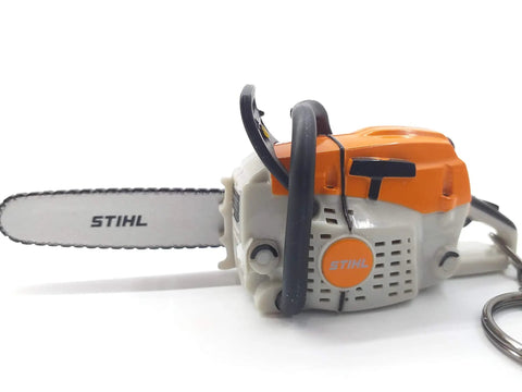 Battery Operated Chainsaw Keyring With Realistic Sound Effects, orange mini tool charm on white background.