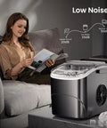Woman reading near Countertop Ice Maker With Handle For Home Kitchen, Fast Bullet Ice Production, 26.5 Pounds Per Day, 9 Cubes In About 6 To 8 Minutes, Two Ice Size Options, Portable Self Cleaning Ice Machine.