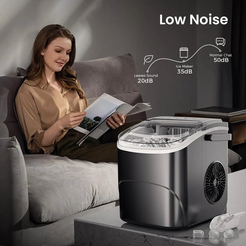Woman reading near Countertop Ice Maker With Handle For Home Kitchen, Fast Bullet Ice Production, 26.5 Pounds Per Day, 9 Cubes In About 6 To 8 Minutes, Two Ice Size Options, Portable Self Cleaning Ice Machine.