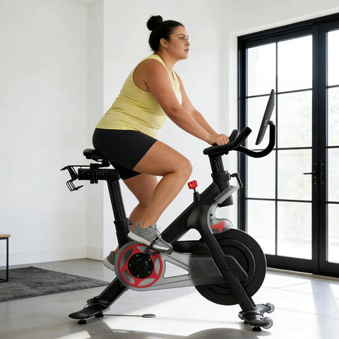 Woman using Toe Cage Adapters For Peloton Bike And Road Cleats Convert SPD-SL Look Delta Keo To Toe Cages With Strap indoors
