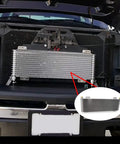 Transmission Oil Cooler With Mounting Hardware For 40K GVW Vehicles installed in front of vehicle grille, close-up view.
