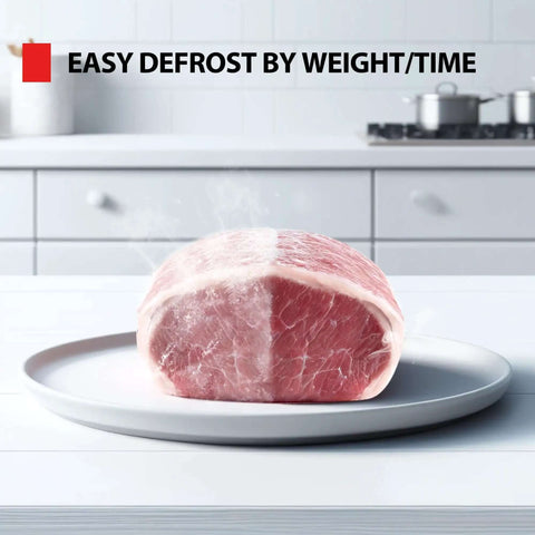 Frozen meat on a plate showing easy defrost by weight/time feature of the Compact Space Saver 0.9 Cu Ft Microwave Oven