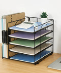 Five Tier Desk Organizer With Letter Trays And File Holder Space Saving Desktop Organizer For Office Supplies, black metal, with documents and calculator.