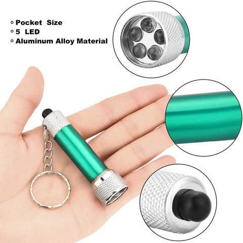 Set Of 30 Mini LED Keychain Flashlights With 5 Bulbs, Ultra Portable Pocket Lights For Camping in hand, green aluminum, close-up view.