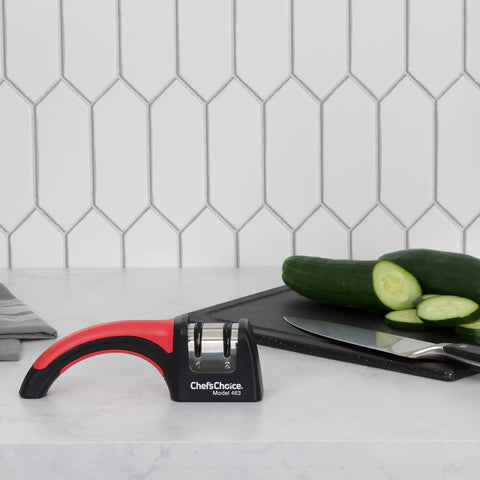 Pronto Hone 15 Degree Knife Sharpener Two Stage for Straight Edge and Serrated Knives on kitchen counter with cucumber