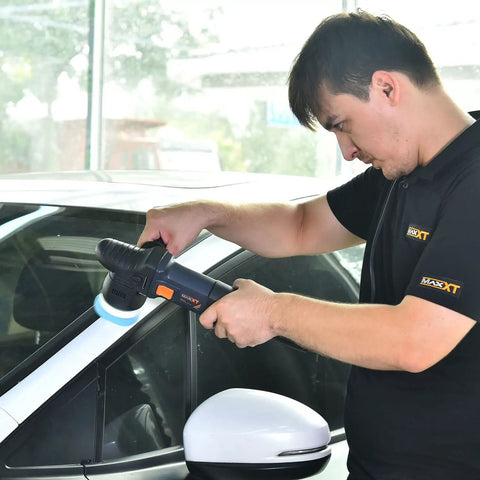 User polishing car with 3 Inch Dual Action Car Buffer Polisher With 9mm Orbit, Variable Speed 6A Motor, Soft Start, Low Noise Operation.