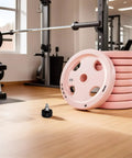 Get Your Gym Session Rocking With 4 Heavy Duty Pull Pin Springs For Exercise Bikes And Training Gear, Sturdy Iron And Abs Steel Height Adjust Locks That Are Easy To Install And Built To Last A Long Time, featuring a black pull pin spring knob and pink weight plates.