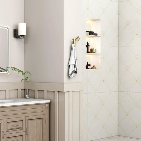 Three Arm Brushed Gold Folding Swivel Towel Hook Space Saving Metal Towel Holder For Bathroom Robe And Coat Also Perfect RV Organizer Screw Mount Smooth Fold Easy Install No Closet Needed visible on bathroom wall with towel.