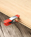 Heavy Duty 2 Inch Metal Spring Clamps Set, 20 Pieces, Rubber Tip Clip securing wood, galvanized steel construction visible