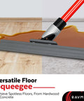 Long Reach Silicone Squeegee With 55-Inch Handle And 12-Inch Silicone Blade shown cleaning hardwood floor with liquid spill.