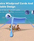 Family under Portable Beach Shade Tent Sun Shelter UPF50 Canopy With Sandbags for family beach days, showcasing easy setup.
