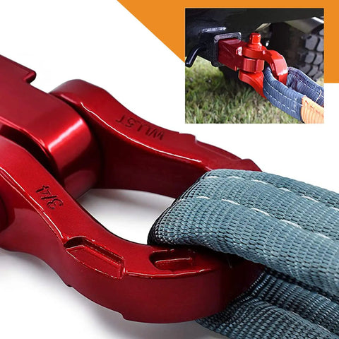 Close-up of red aluminum bow shackle connecting tow strap, Aluminum Alloy Ultra Bow Shackles For Off Road Recovery, attached to vehicle.