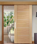 Interior view of a wooden sliding barn door with Two Pack Sliding Barn Door Handles 7.9 Inch Aluminum Alloy Pull Handles For Sliding Barn Doors Gates Cabinets Closets Drawers Garage Shed White Finish Includes Eight Mounting Screws For Easy Installation, installed in a modern home setting.
