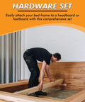 Man assembling a bed frame using the Solid As A Rock Replacement Bed Frame Hardware Kit With Heavy Duty Screws And Bolts For Metal Frames No Fuss Assembly Of Headboard And Footboard 42 Piece Set.