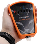 Person holding a Low Voltage Fused Multi Jumper With Selector Switches For Thermostat Bypass And Quick Fix Short Cycle Prevention In 0 To 30 VAC DC Systems Includes Spade Adapters.