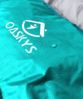 Close-up of Three Season Camping Sleeping Bag for Adults and Kids, lightweight, weatherproof, waterproof, teal 210T shell.