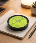 Qianly Bubble Level with Degree Markings Metal Circular Spirit Level Compact for Home Improvement Hobbyists, Turntable Alignment, Black Shell, Green Liquid, 60x12mm on a notebook.