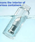 Portable Ultrasonic Cleaning Wand Featuring 60khz Sonic Cavitation Technology For Jewelry Glasses Watches And Dentures Fits Any Sink Or Bucket To Work Like A Champ And Knock Out Stubborn Grime Fast submerged in water cleaning a glass container.