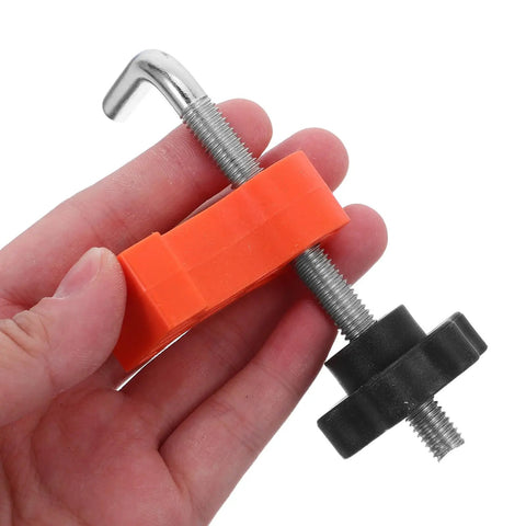 Grab These Sweet 12 Pc Right Angle Clamps For Stone Wood Slabs And Granite To Nail Perfect Masonry Joints Seam Alignment Precise Corner Workholding Like A Total Boss, showing an orange and black clamp in hand.