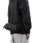 Person wearing Bike Handlebar Bag Front Bag Frame Storage Roll Bag For Mountain And Road Bikes Commuters Grab And Go Storage.