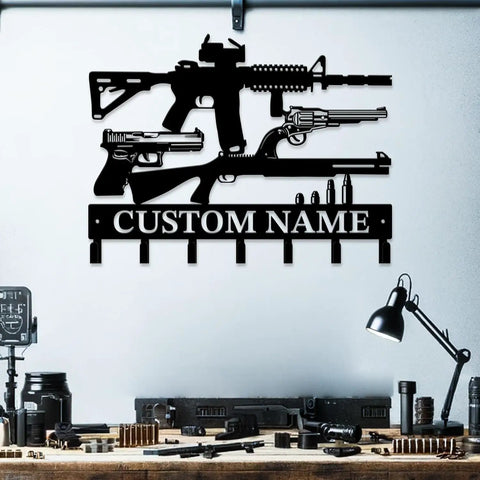 Gun Theme Wall Hooks For Keys And Clothes Personalized Cast Iron Key Holder And Coat Hanger In Matte Black displayed on wall