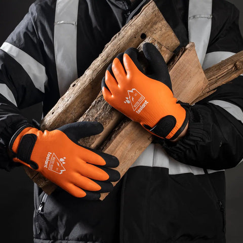 Worker wearing 100% Waterproof Winter Work Gloves For Men And Women With Thermal Insulation Double Layer Fully Dipped Latex For Maximum Grippy Touchscreen Compatibility Cold Weather Outdoor And Freezer Use Orange Large, holding wooden logs.