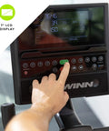 Hand using 7-inch LCD display on Recumbent Exercise Bike With 2 Month JRNY Membership For At Home Or On The Go Workouts