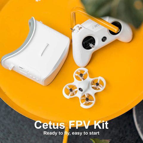 Cetus FPV Kit RTF Brushed Racing Drone Bundle With LiteRadio 2 SE Transmitter And VR02 Goggles on a yellow surface