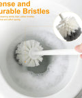 Heavy Duty Toilet Plunger And Brush Set With Nifty Hideaway Stand, showing dense bristles cleaning a toilet bowl.