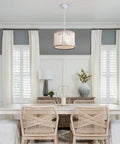 Dining room featuring Bohemian Wood Beaded Chandelier Three Light Pendant With White Finish over a wooden table.